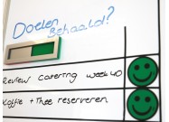 Magnetic status slider on whiteboard green